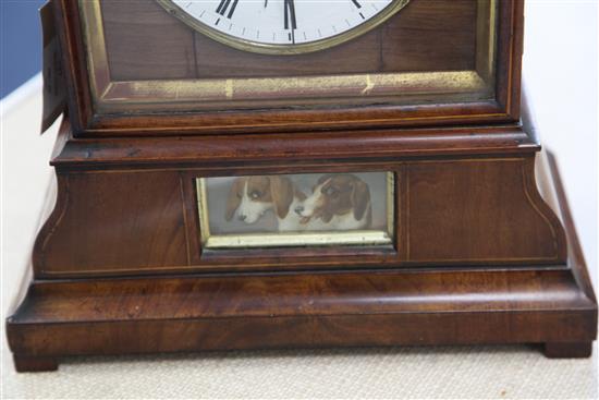 A 19th century Black Forest mahogany mantel clock with automaton and cuckoo, 17.5in.